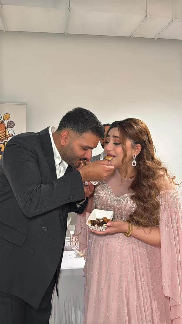 Parents-to-be enjoying Yayam's Station mini pancakes at their baby shower